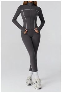 Slim-fit dark grey yoga set detail with contrast stitching and thumbholes on sleeves