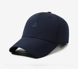 Detail view of the deep blue baseball cap showing 3D embroidered NEAR&DEAR logo on the side
