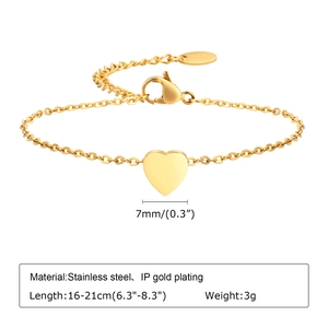 Detail of 7mm gold heart pendant on adjustable 16-21cm stainless steel bracelet