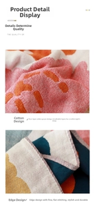 Detail of four-layer cotton gauze towel with abstract floral patterns and fine edge stitching