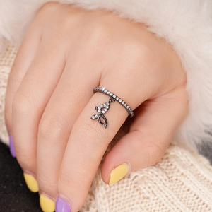 Elegant black butterfly pendant ring for women with cubic zirconia accents on finger
