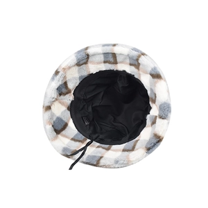 Detail view of plaid faux fur bucket hat with soft lining and adjustable inner drawstring