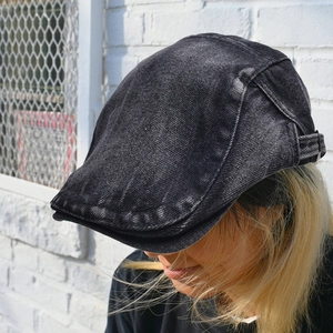 Retro black washed denim flat top cap with adjustable metal buckle and vintage texture