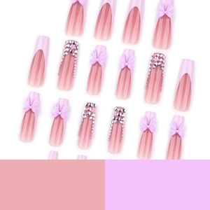 Long coffin french press-on nails with purple gradient, 3D bows, and pink rhinestones