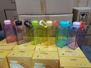 Close-up of six 1000ml flat square sports water bottles in various translucent colors