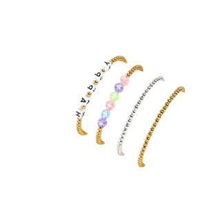 Set of four 4mm round gold and silver beaded bracelets with personalized alphabet charms