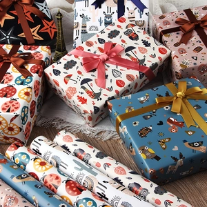 Cartoon animal gift wrapping paper rolls with cute owl and alpaca prints for kids