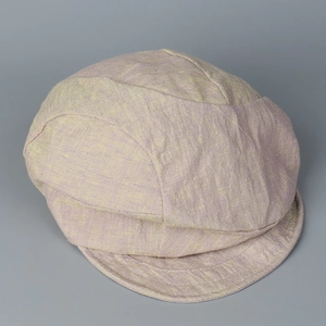 Detailed top view of light purple distressed linen fabric with metallic thread texture