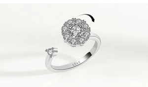 Macro detail of rotating silver snowflake flower ring with 925 sterling silver hallmark