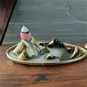 Mountain landscape backflow incense burner in brass finish with flowing smoke effect