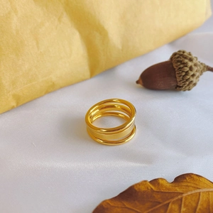 Three-layer 18k gold plated stainless steel ring with a polished minimalist finish