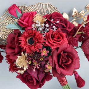 Chinese wedding bridal bouquet with red velvet roses and gold fan leaves decor