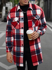 Close-up of red and black plaid shacket with two flap chest pockets on a male model