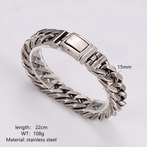 Mens silver stainless steel 15mm chunky Cuban link bracelet on a clear stand display
