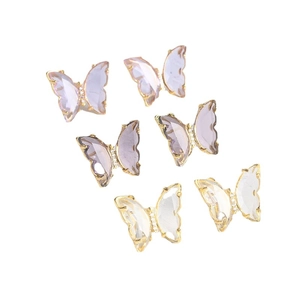 Elegant butterfly stud earrings set in purple and clear glass with gold base detailing