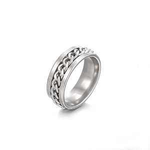 Rotating stainless steel spinner ring with Cuban chain inlay on a white background