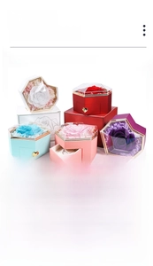 Stack of colorful heart-shaped flower jewelry boxes with transparent acrylic lids
