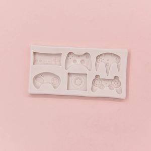 Pink silicone game controller mold with six cavities for baking and DIY crafts