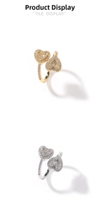 Macro detail of overlapping double heart rings with sparkling iced out crystal pavé