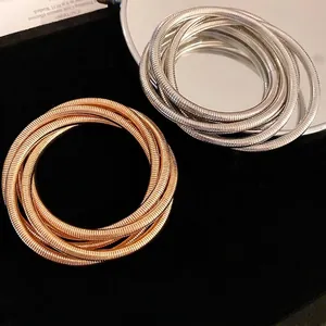 Vintage triple-layered wide stretch metal bracelets in gold and silver finish