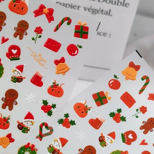 3D Christmas nail art stickers featuring Santa, gingerbread man and festive holiday patterns
