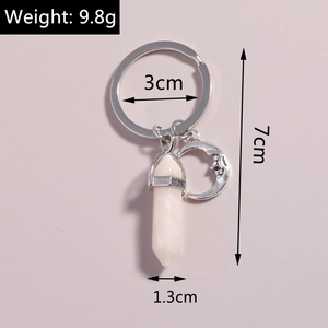 Detail of moon pendant and white hexagonal crystal stone keychain with dimensions