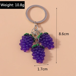 Detail of purple grape keychain charm showing 10.8g weight and 8.6cm length dimensions