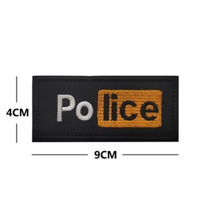 Police embroidered tactical patch with orange and white letters on a black background