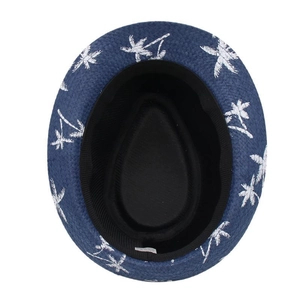 Detail view of navy blue straw fedora with white coconut tree embroidery and inner sweatband