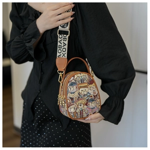 Brown faux leather handbag with teddy bear pattern and wide AOBAOX branded shoulder strap