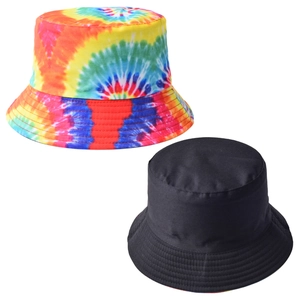 Detail of tie-dye and solid black cotton bucket hats with reinforced stitching on brim