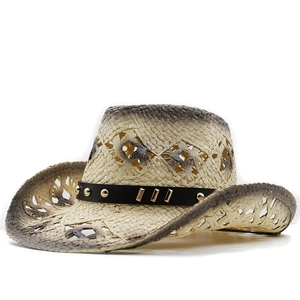 Detail of woven straw cowboy hat featuring black studded band and gradient spray finish