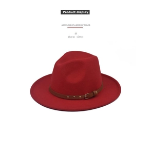 Close-up of red wool felt fedora featuring a brown leather belt with metal buckle