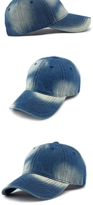 Detailed close-up of washed denim baseball cap with vintage distressed cotton fabric