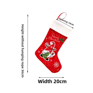 Close-up of a red felt Christmas stocking featuring a gnome and 36cm length details