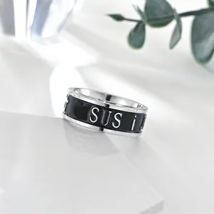 Polished stainless steel ring with black enamel and raised silver JESUS lettering