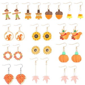 Set of 13 pairs of autumn-themed enamel earrings with maple leaf, pumpkin, and sunflower designs