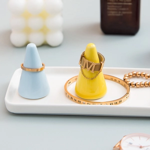 Ceramic cone ring holders with white rectangular tray in blue and yellow pastel tones