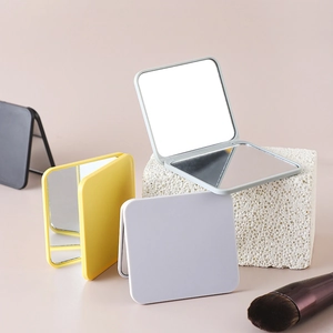 Portable folding square compact mirrors in grey, yellow, white, and black plastic cases