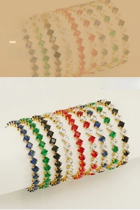 Detail of square-cut zircon tennis bracelets in multiple colors with gold plating