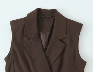 Close-up of deep brown notched lapel vest featuring premium woven fabric and tailoring
