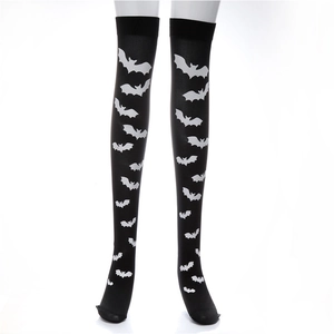 Detailed view of black thigh-high socks with white bat prints over the knees