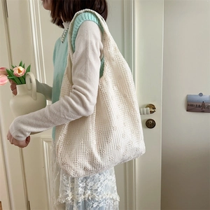 Detailed view of cream floral mesh tote bag showing lace texture and large capacity