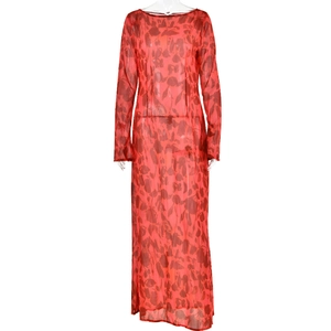 Detailed close-up of bohemian red floral mesh fabric and long-sleeved sheer dress texture