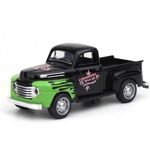 Detailed side view of a vintage metal pickup truck model with green flame patterns