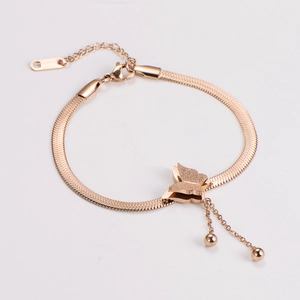 Close-up of rose gold butterfly charm on flat snake chain with polished and frosted finish
