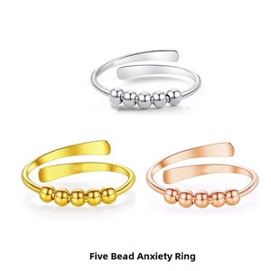 Adjustable five-bead spinning anxiety rings in silver, gold, and rose gold finishes