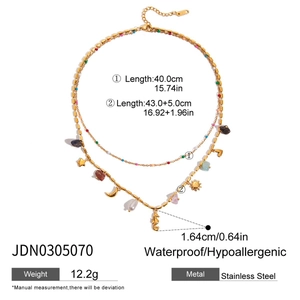 Detail view of double-layer gold stainless steel necklace with sun and moon charm sizes
