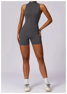 Detail of high-stretch dark grey activewear romper with front zipper and mock neck