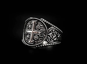 Detail of vintage silver stainless steel ring with embossed Jerusalem cross motif